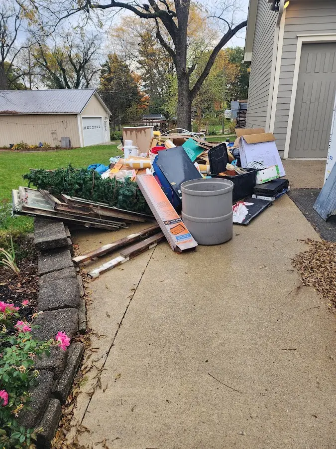 Dumpster being loaded with debris for 3 Yard Dumpster Rental in Lake Norman of Catawba
